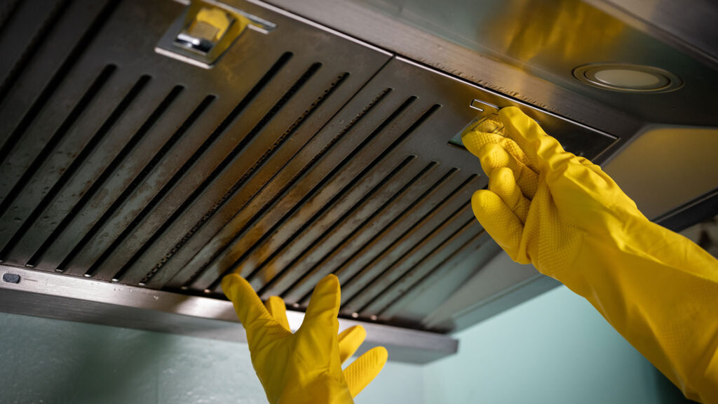 Clean commercial kitchen exhaust hood after service